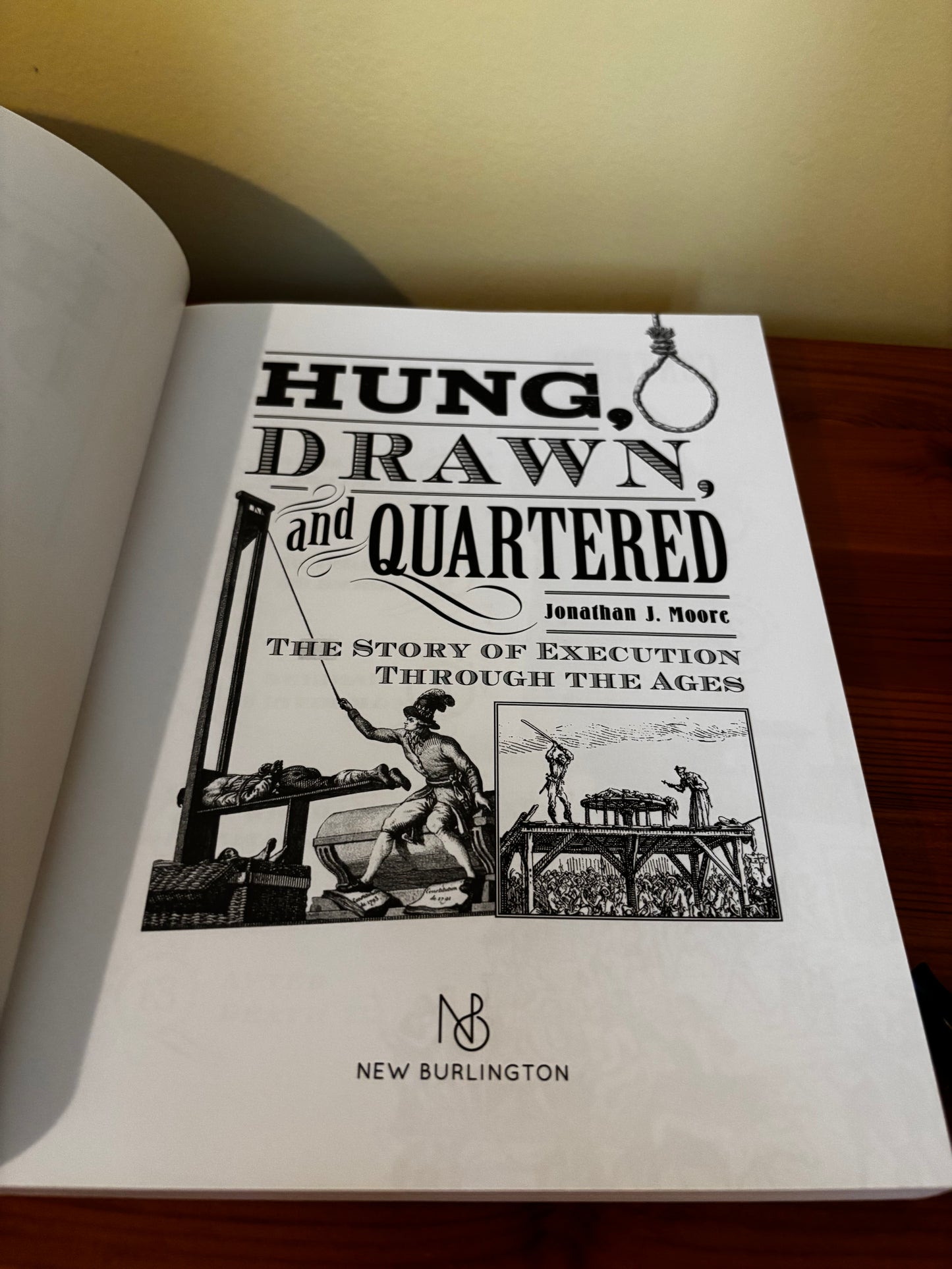 Cover of "Hung Drawn And Quartered The Story Of Execution Jonathan Moore" by New Burlington, exploring historical executions.