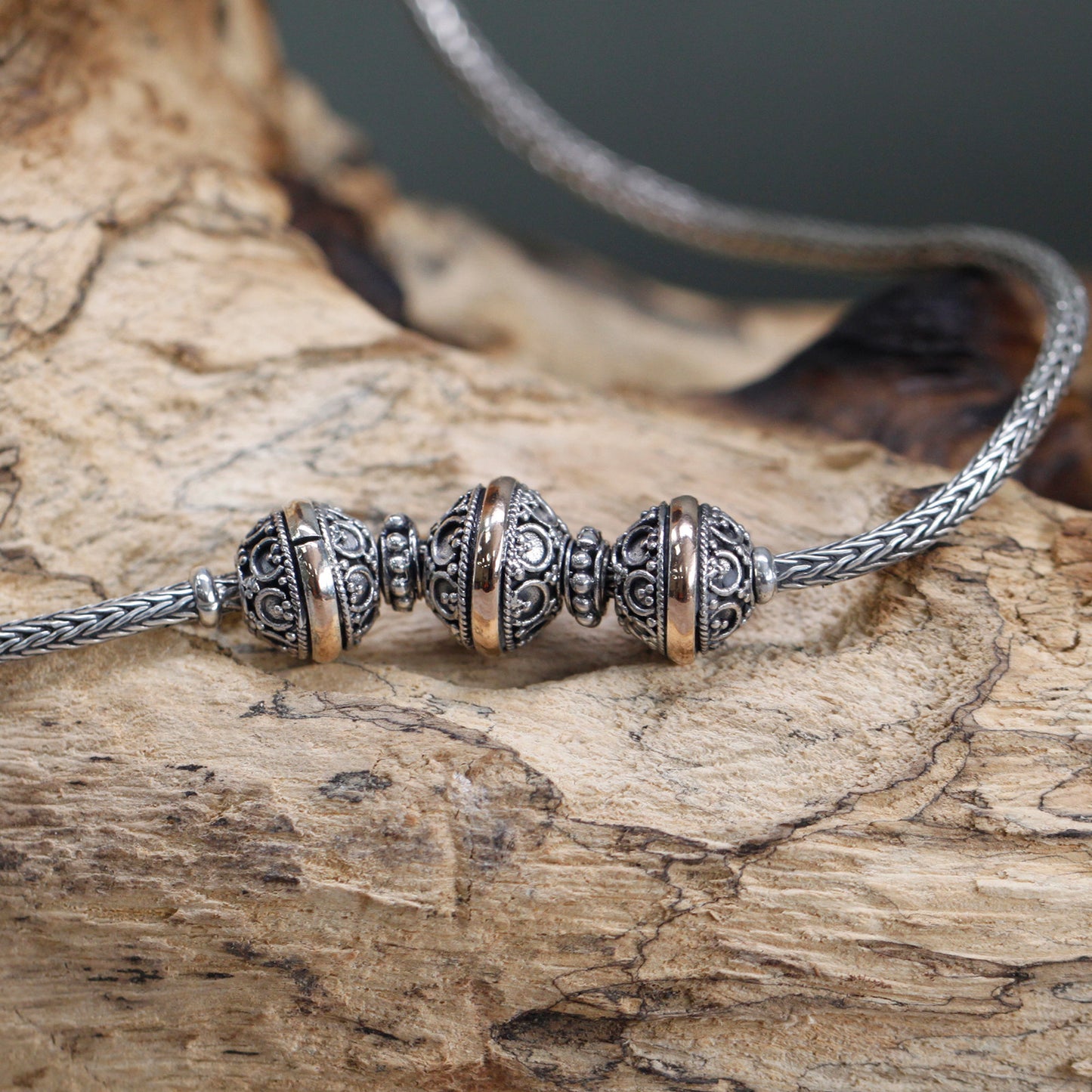 Elegant Silver & Gold Necklace -Tri featuring intricate design, crafted from 18k gold and 925 silver.