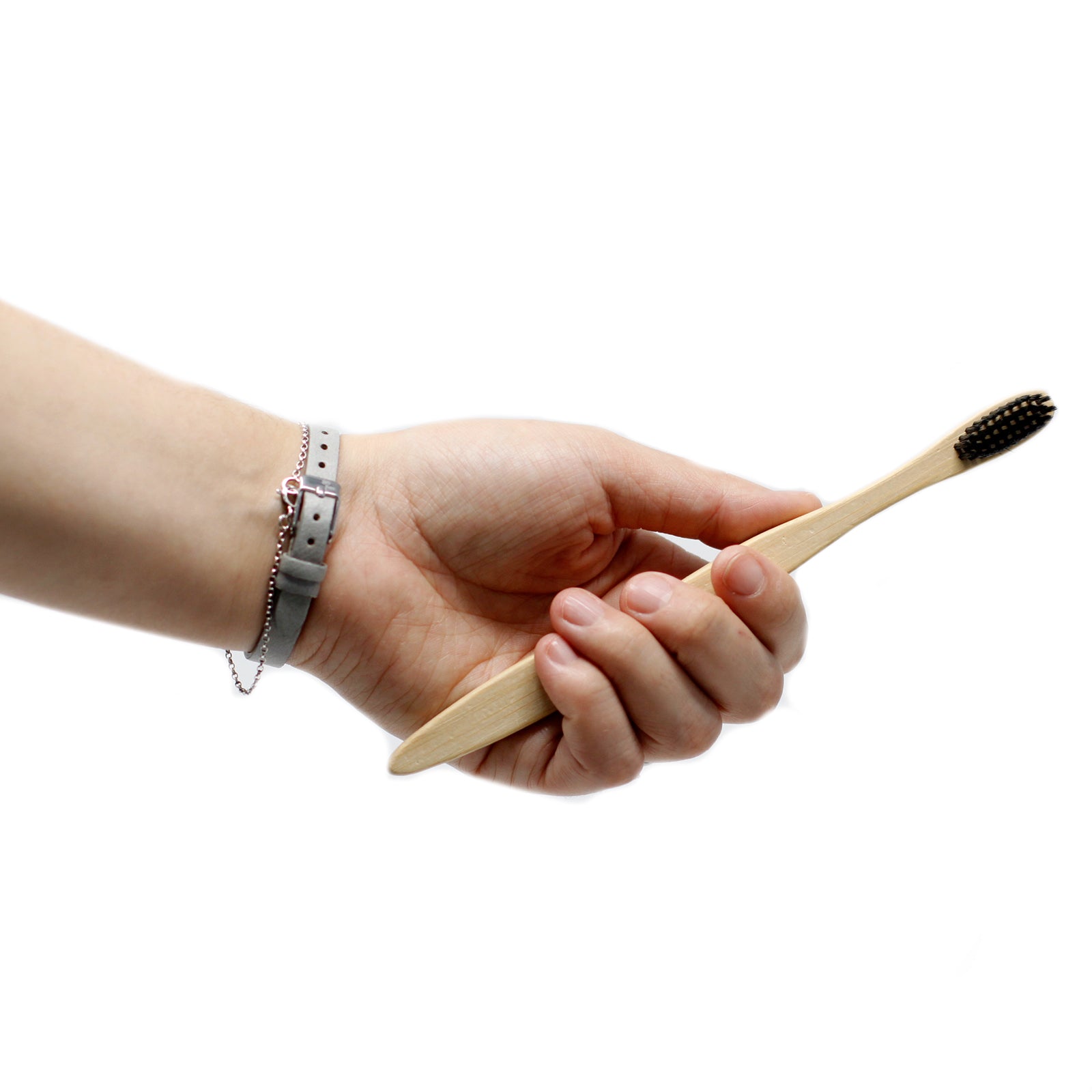 Bamboo Toothbrush - Charcoal Medium Soft held in hand, eco-friendly choice from AW Earth for sustainable dental care.