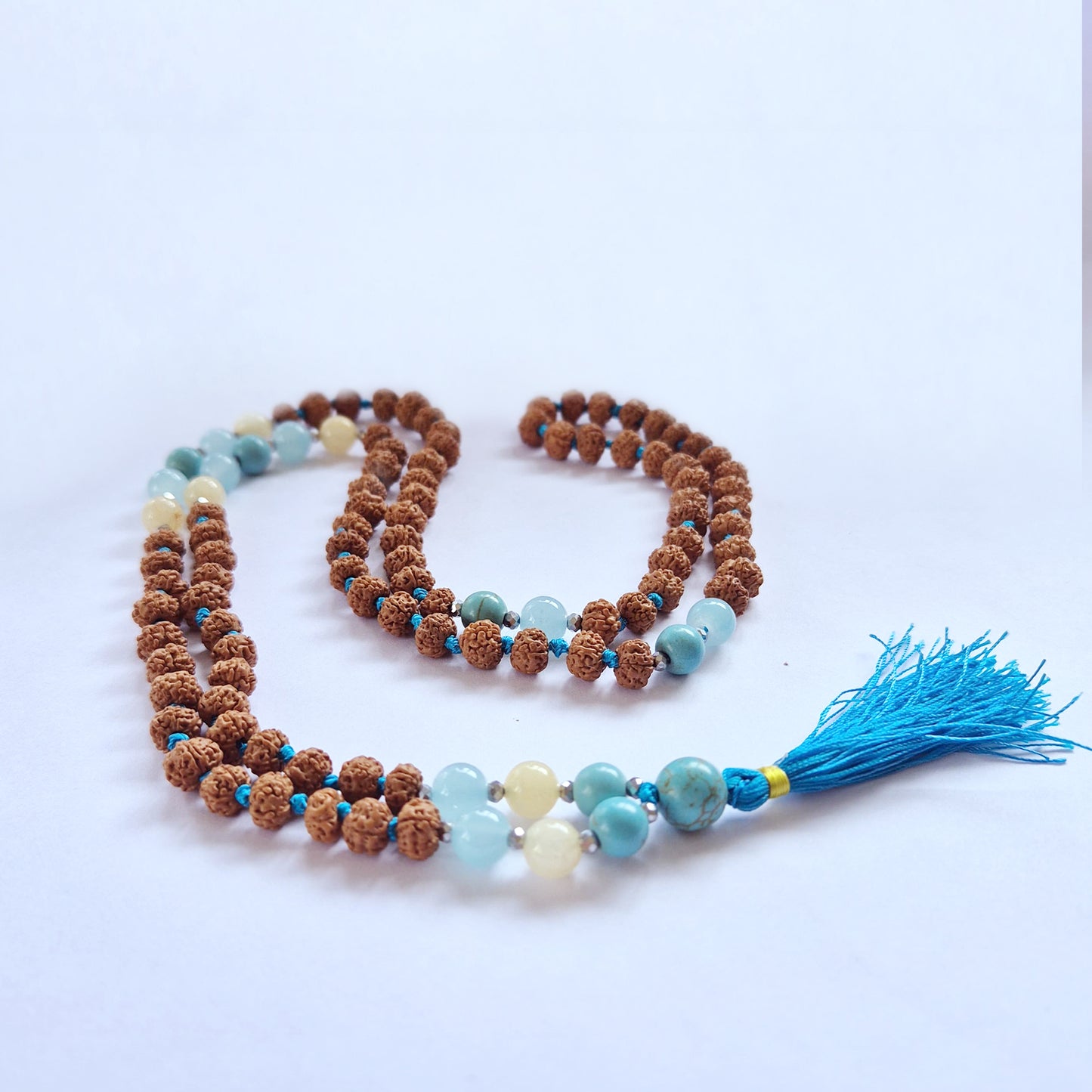 Explore the Bali Mala Necklace - Choose your Favourite, featuring sacred Rudraksha beads for self-realisation.