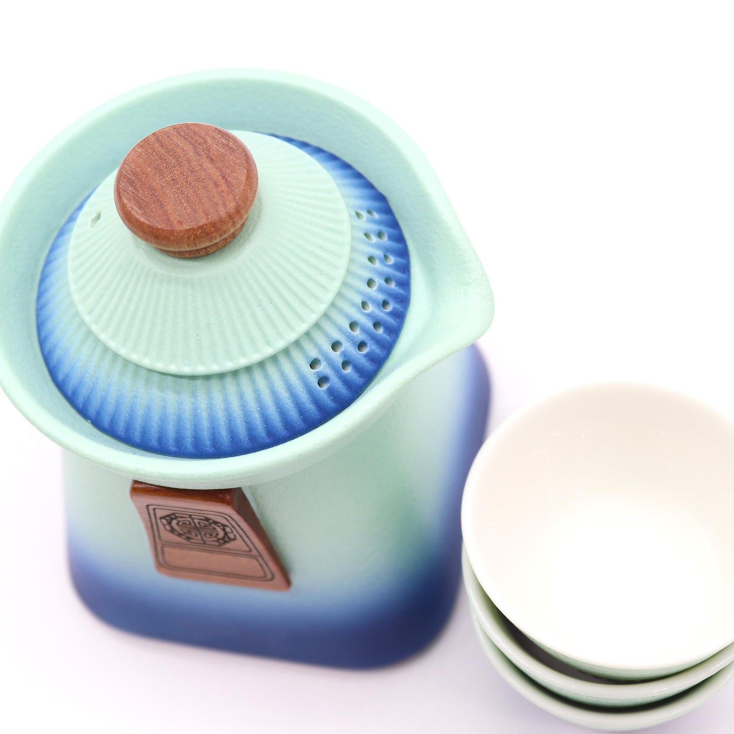 Ceramic Temple Teapot Set with three cups in Blue Heaven, perfect for elegant tea moments.