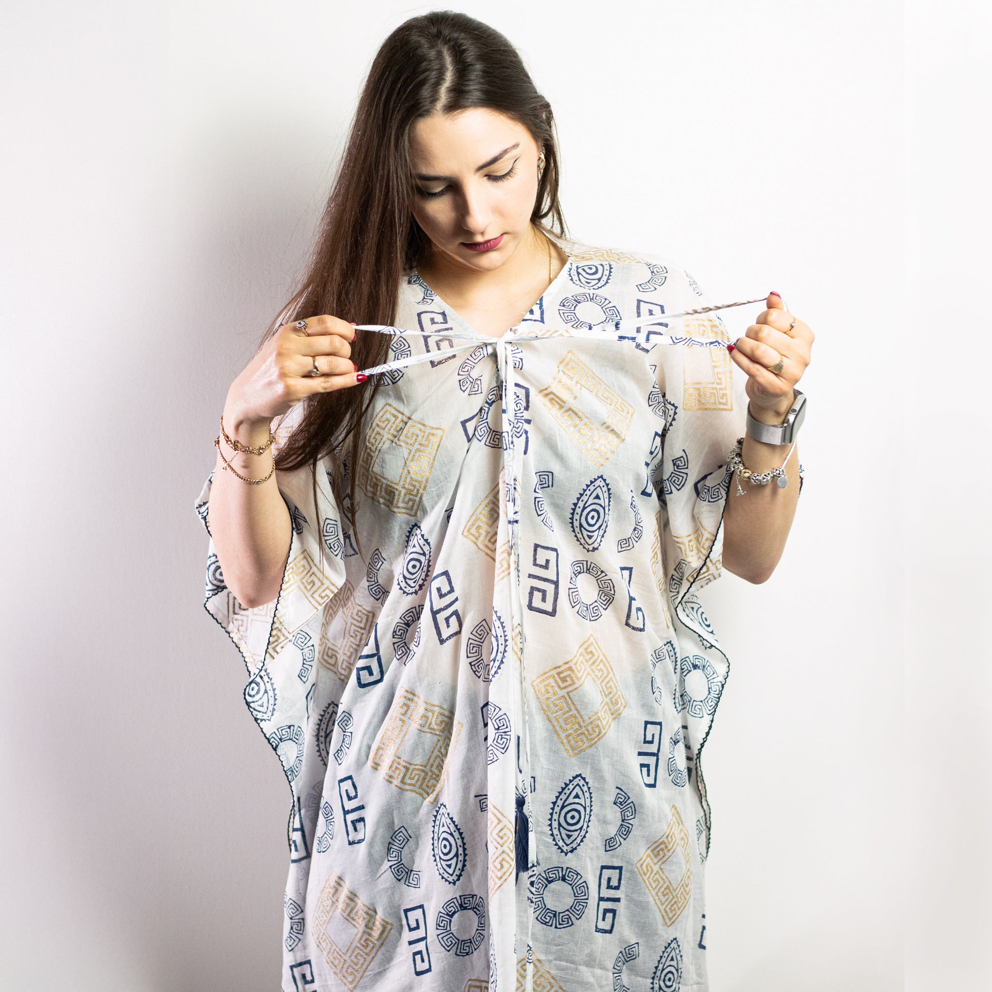 Stylishly showcasing the Nomad Sari On the Med Collection - Kaftan - Choose your Design, featuring vibrant patterns.