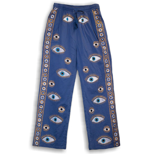 Nomad Sari On the Med Collection - Lounge Pants - Rich Blue featuring a hand-painted evil eye design, perfect for relaxed wear.