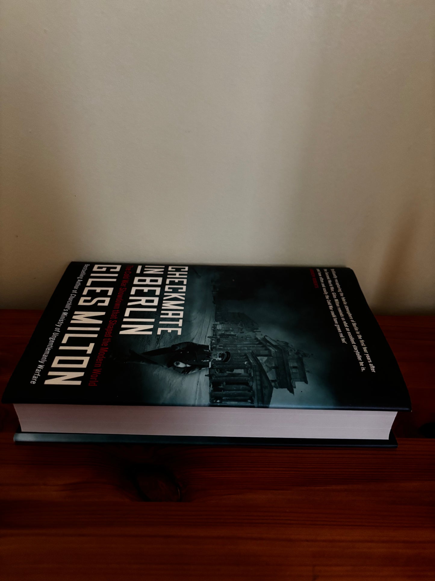 Checkmate in Berlin: The Cold War Showdown That Shaped the Modern World Hardcover – 27 May 2021 displayed on a wooden surface.