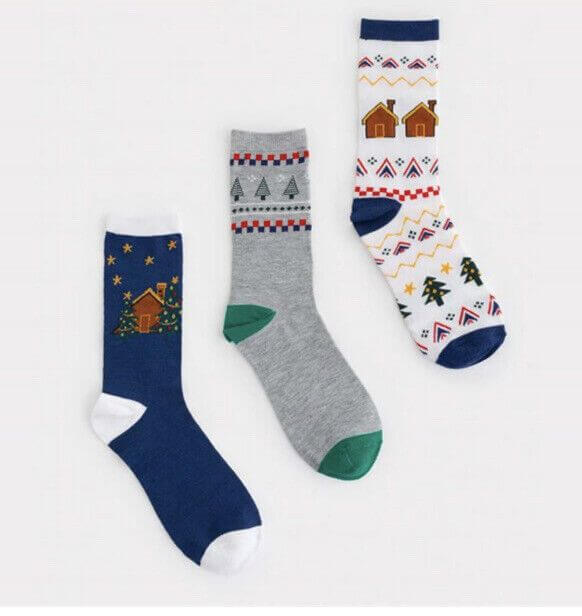 Brighten your Christmas with Avon Boxed Men's Festive Crew Socks, featuring three vibrant, festive designs.