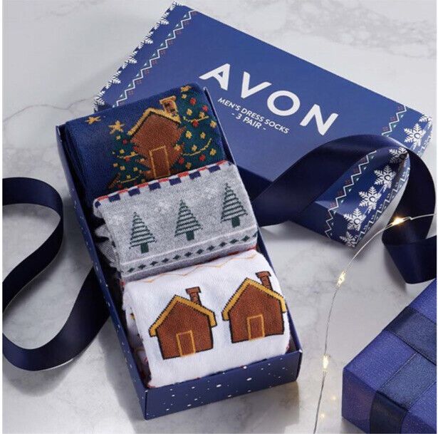 Avon Boxed Men's Festive Crew Socks gift set features Christmas-themed designs in a vibrant collection of three pairs.