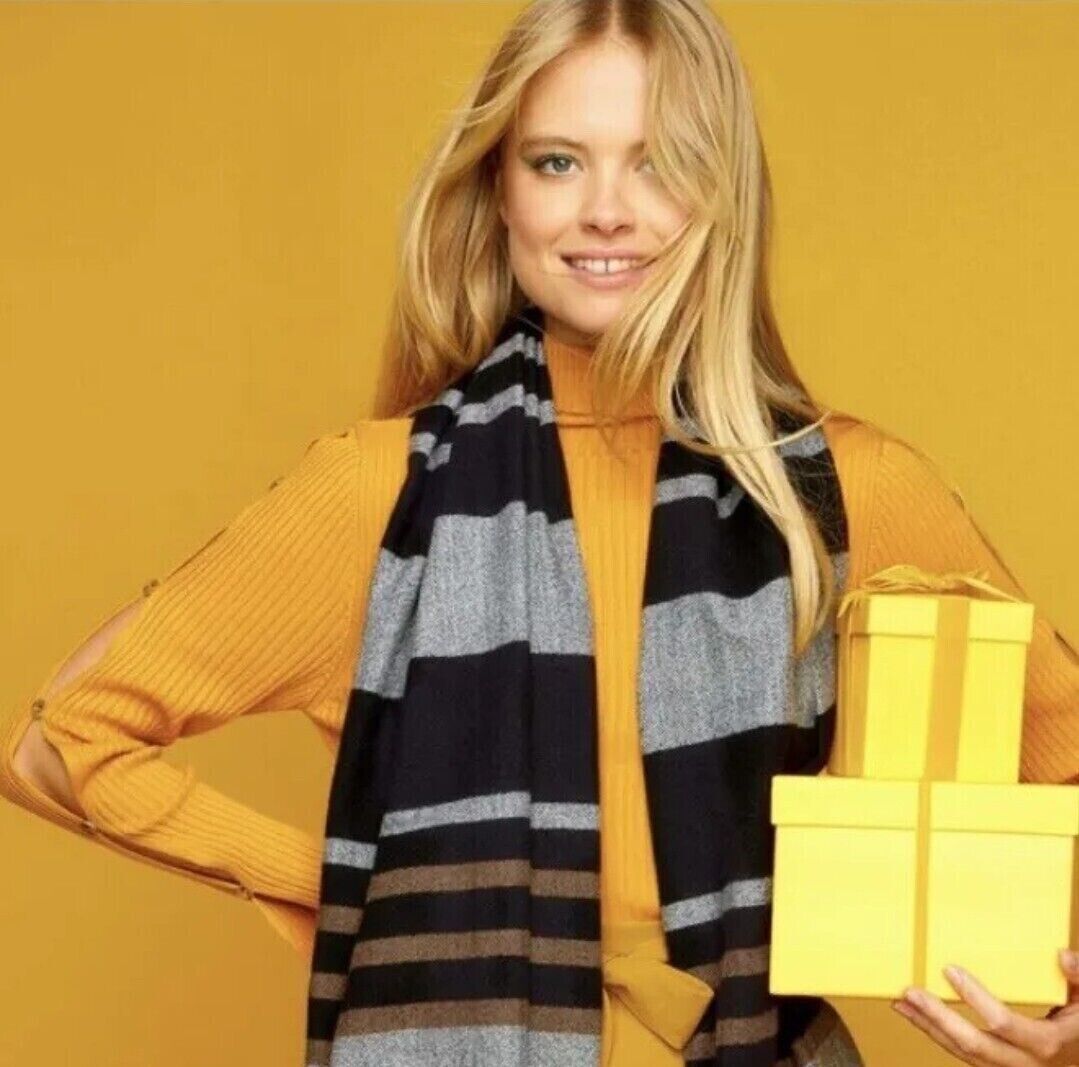 Stylishly wearing the Avon Atlas Multiway Scarf, a versatile accessory perfect for elevating any outfit.