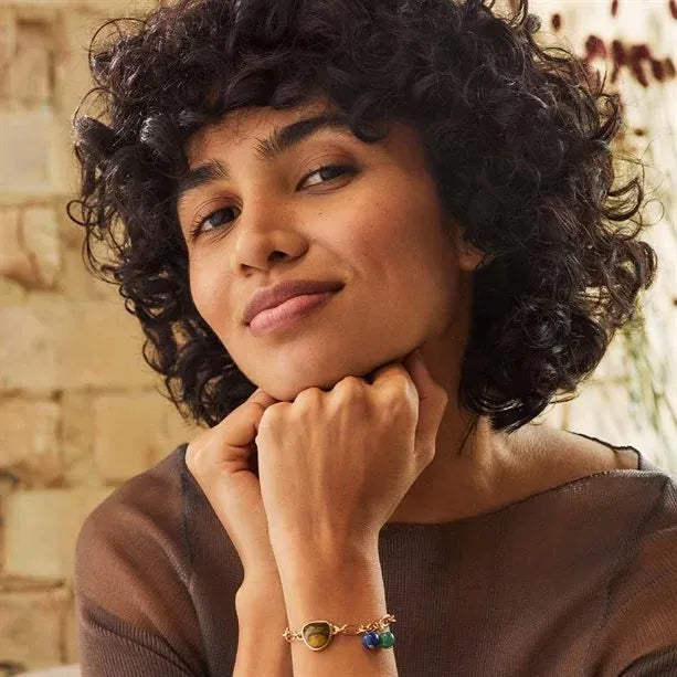 Showcasing the Avon Elodie Statement Stone Bracelet, this elegant accessory features multicoloured stones for a chic look.