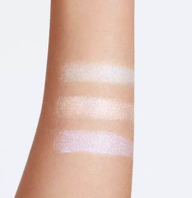 Swatches of Avon Sunset Beats Glitter Toppers Eyeshadow showcasing iridescent shades for stunning day-to-night looks.