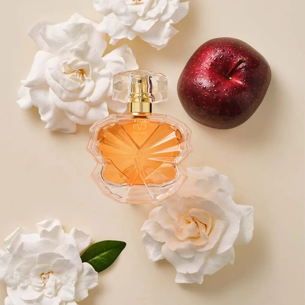 Avon NEW Eve Become EDP for Her, a captivating fragrance, beautifully presented with roses and an apple.