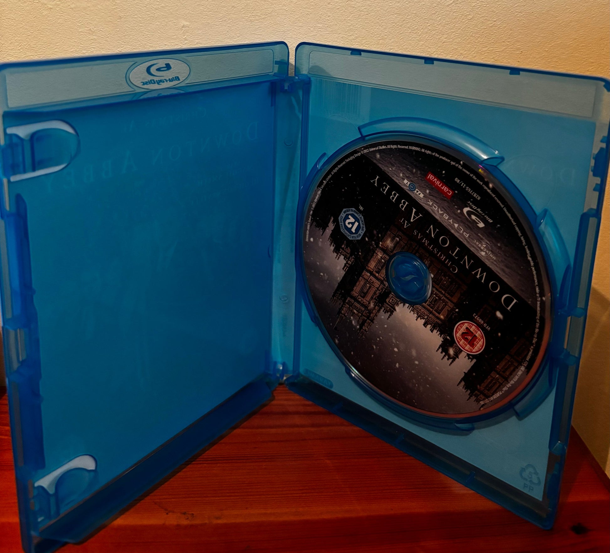 Open Blu-Ray case showcasing the disc for Christmas at Downton Abbey (Blu-Ray), a festive classic for collectors.