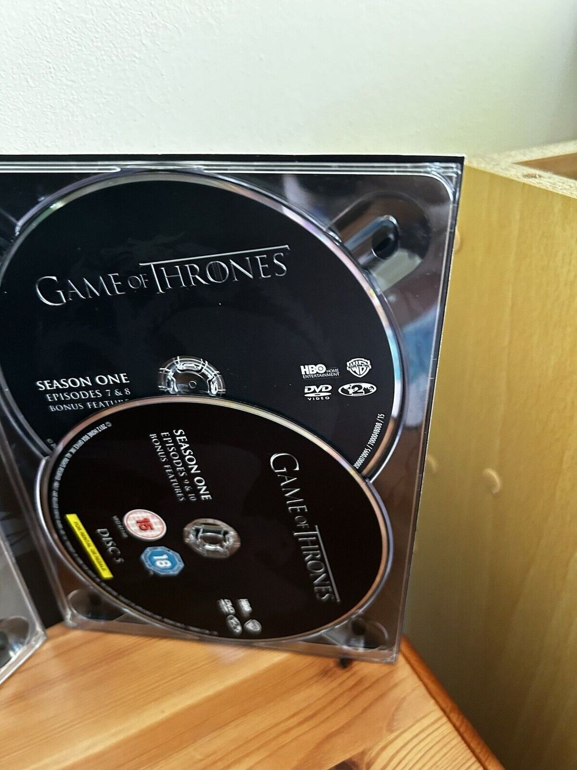 Game Of Thrones - Season 1 discs showcased in a complete box set, perfect for any epic storytelling fan.