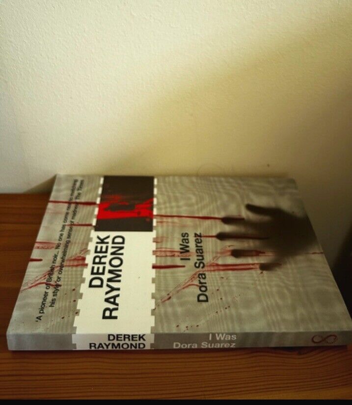Preloved copy of I Was Dora Suarez: Factory 4 (Book) by Derek Raymond, showcasing its intriguing cover design.