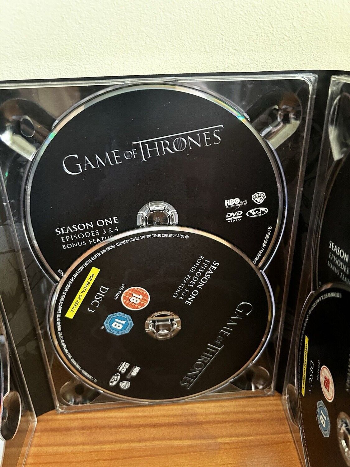 Game Of Thrones - Season 1 DVD discs showcasing epic drama in this complete box set for fans at your store.