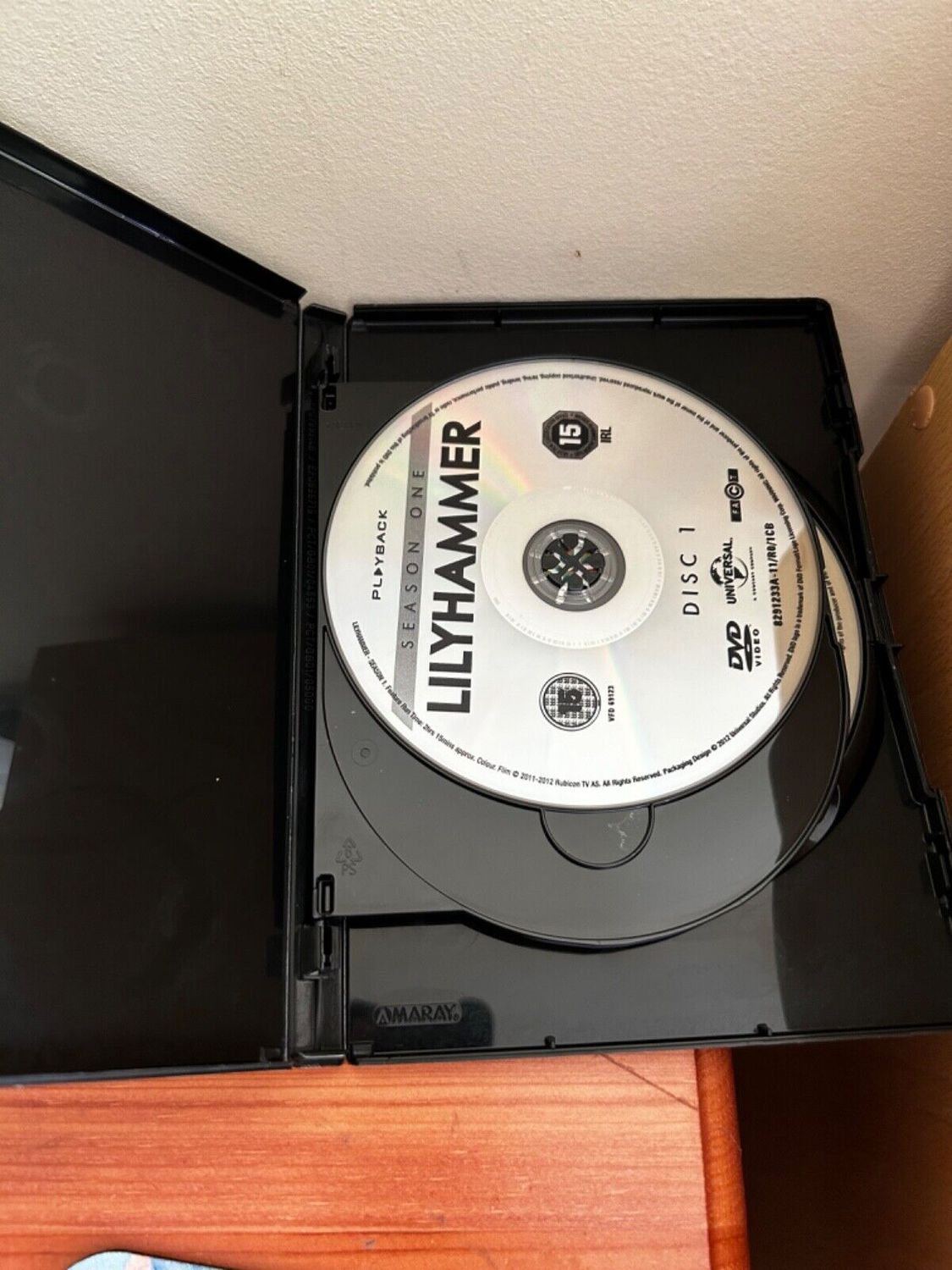Lilyhammer Season One (DVD) disc in a black case, perfect for fans of crime drama and dark humour. Preloved condition.