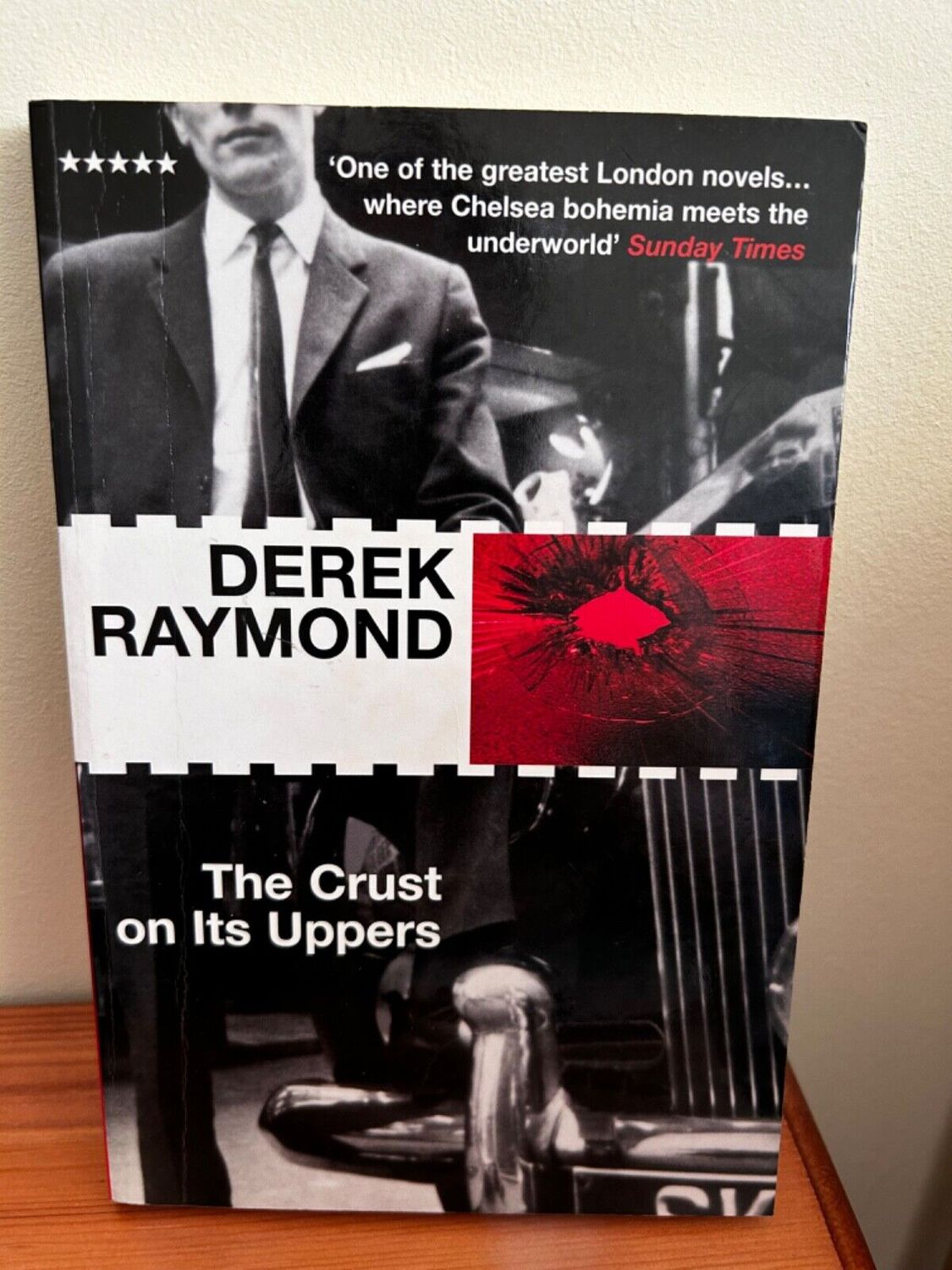 Explore London’s underbelly with Derek Raymond's gripping novel, The Crust on Its Uppers (Five Star) (Book).