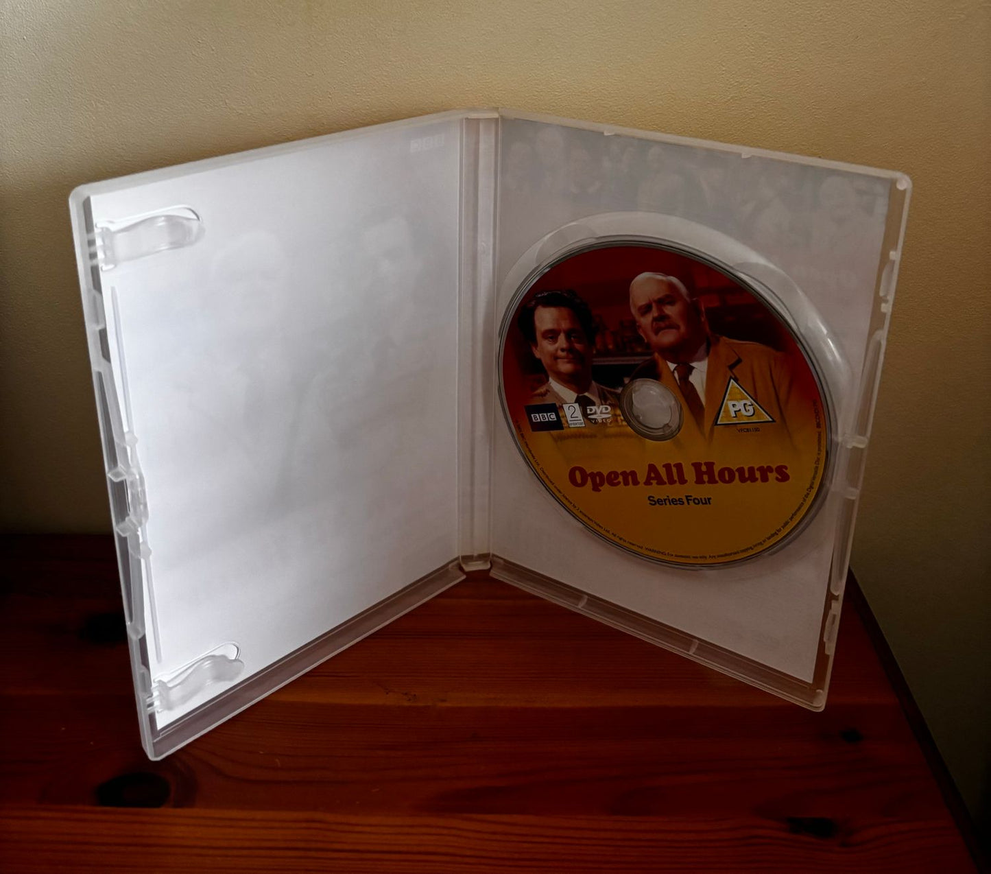 Preloved DVD showing "The Complete Open All Hours - Series One to Four (1976)" inside a transparent case.