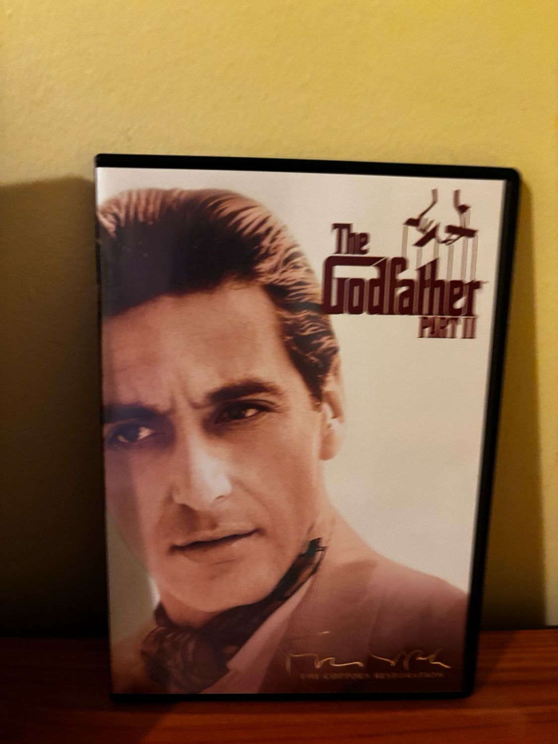 Collector's Edition of THE GODFATHER Films 1-4 (DVD) Box Set showcasing iconic characters and cinematography.