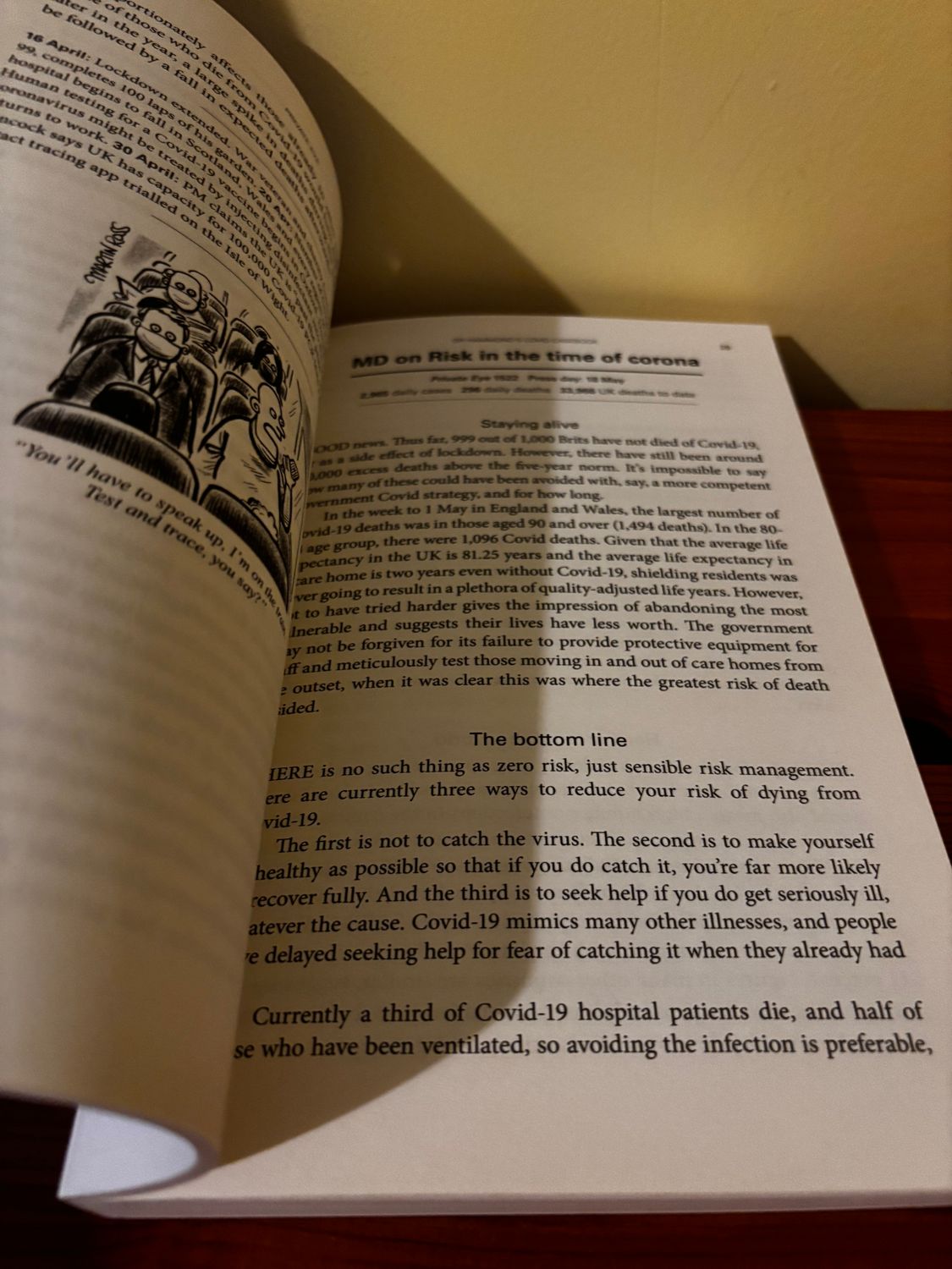 Open pages of the DR HAMMOND COVID CASE BOOK PRIVATE EYE show insightful pandemic commentary by Phil Hammond.