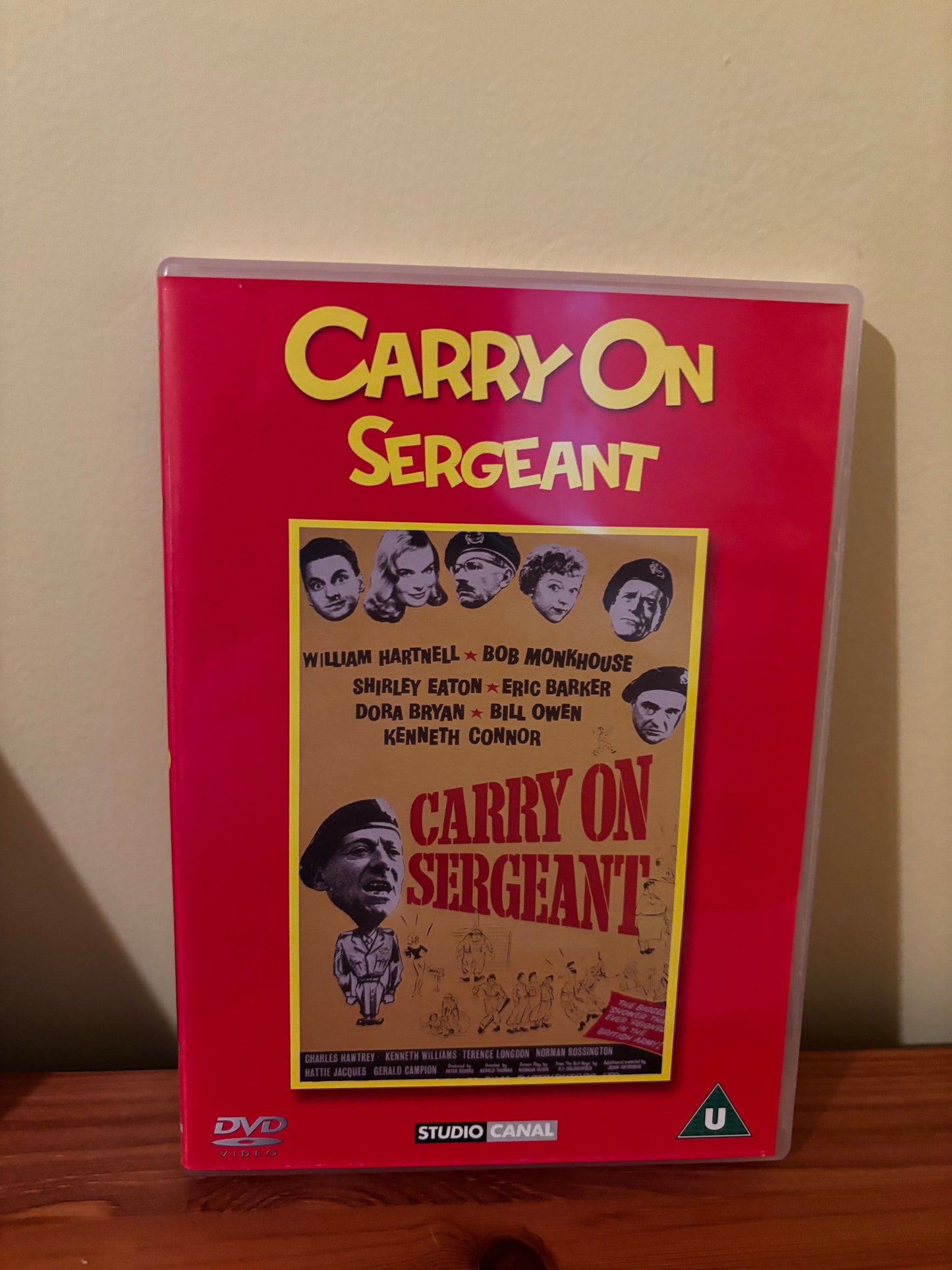 Carry On Films (Various) Please Choose From Dropdown showcases classic British comedy on this vibrant DVD cover.
