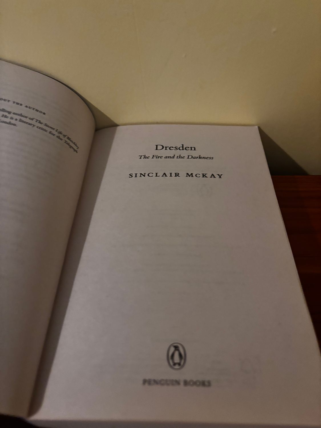 Dresden: The Fire and Darkness - Paperback edition by Sinclair McKay, published by Penguin, showcasing haunting war narratives.