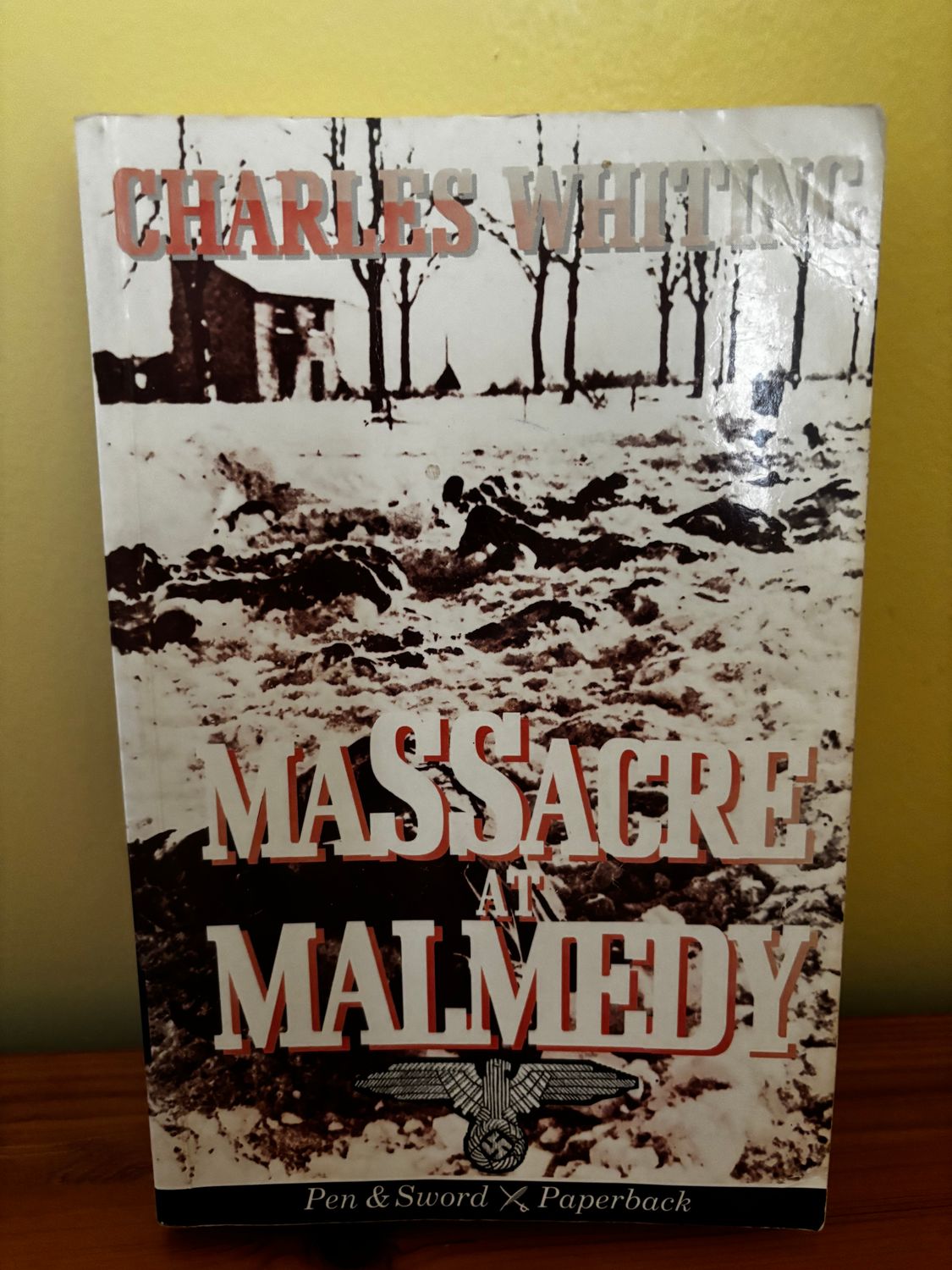 Massacre at Malmedy (Pen & Sword paperback) by Charles Whiting, detailing a tragic World War II event.