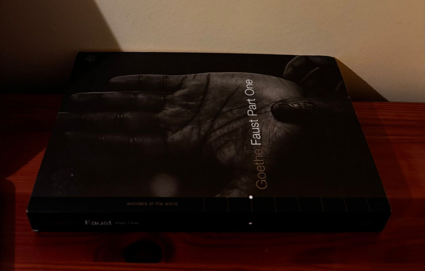 Faust: Part One - Johann Wolfgang Von Goethe (2001, Penguin) displayed on a wooden surface, highlighting its artistic cover.