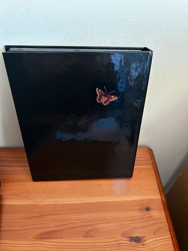 Just a Gigolo Blu-ray (2021) David Bowie, Hemmings (DIR) presented in a sleek black case with a butterfly design.