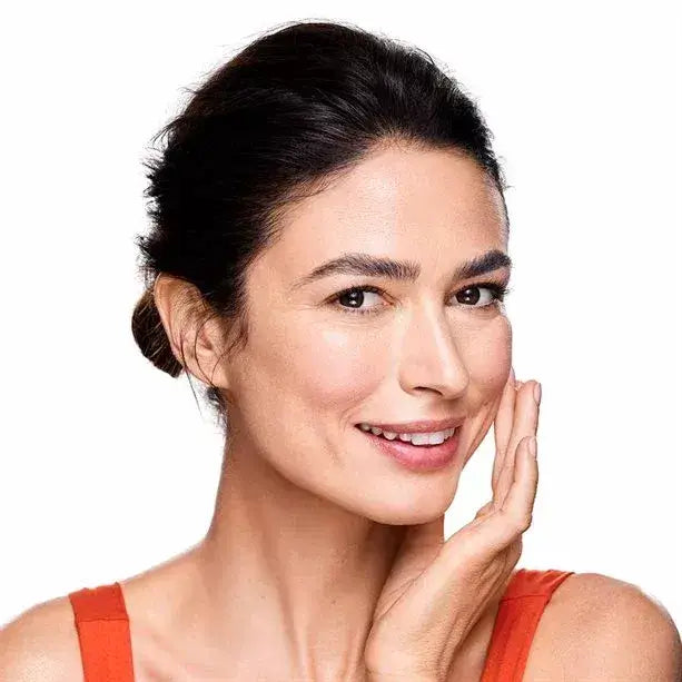 Radiant skin enhanced by Avon Anew Radiance Maximising Tonic, featuring a smiling woman showcasing her glow.