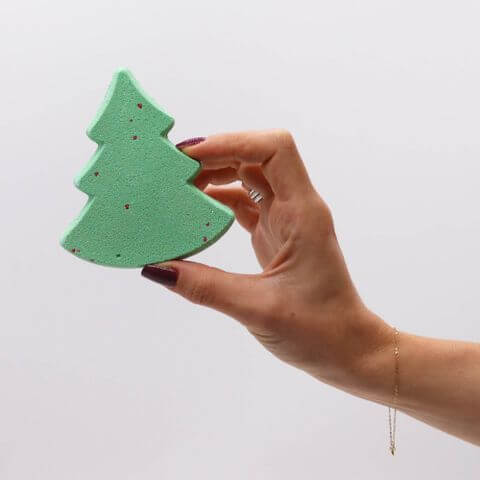 Handcrafted tree-shaped bath bomb from the Silent Night Christmas Bath Bomb Gift Pack, perfect for festive relaxation.