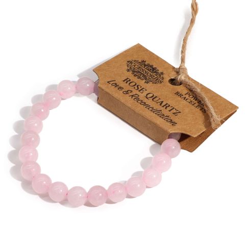 Elegant Power Bracelet - Rose Quartz enhances any outfit while promoting love and reconciliation for a perfect accessory.