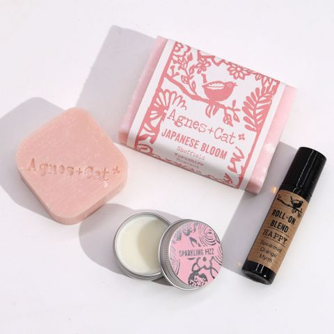 Wellness gift set from Agnes & Cat featuring Japanese Bloom soap, shampoo, lip balm, and essential oil blend.