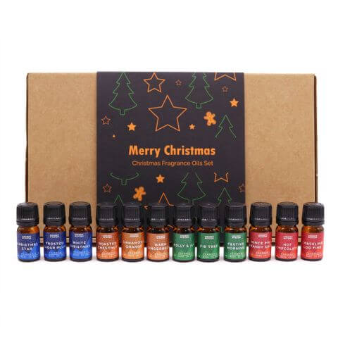 Festive Delights Fragrance Set showcases a collection of festive oils in a charming box, perfect for holiday cheer.