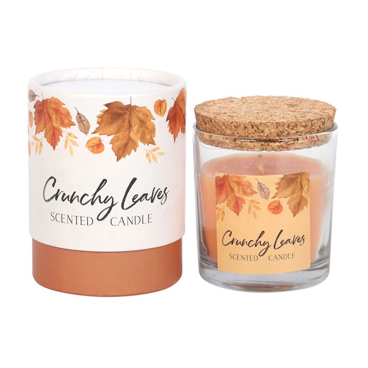 Crunchy Leaves Autumn Candle in a glass holder with cork lid, beautifully packaged for cosy autumn vibes.