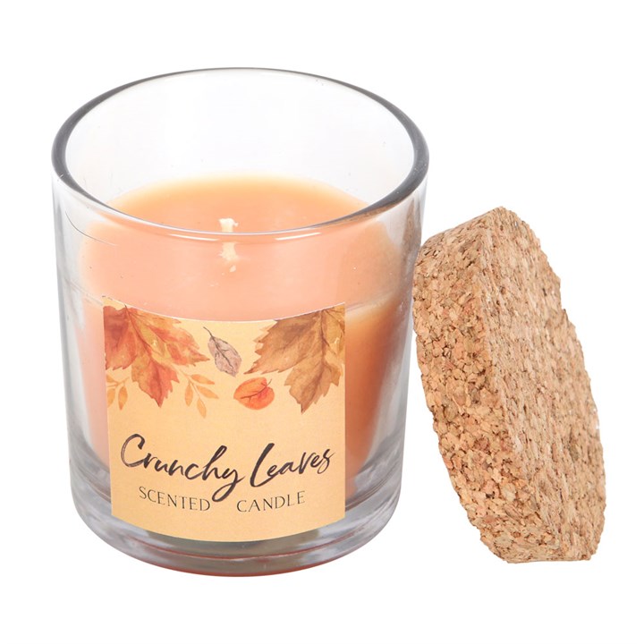 Crunchy Leaves Autumn Candle in a glass holder with cork lid, perfect for cosy autumn days and home ambience.
