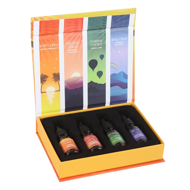The Happy Collection Blended Essential Oil Set features four aromatic oils in a vibrant gift box for wellness.