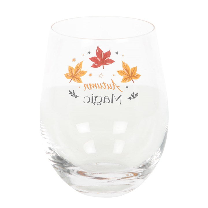 Clear Autumn Magic Stemless Glass with golden stars and autumn leaves, ideal for wine or spiced cider. Perfect for gifting.