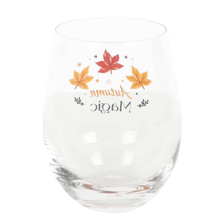 Clear Autumn Magic Stemless Glass with golden stars and autumn leaves, ideal for wine or spiced cider. Perfect for gifting.