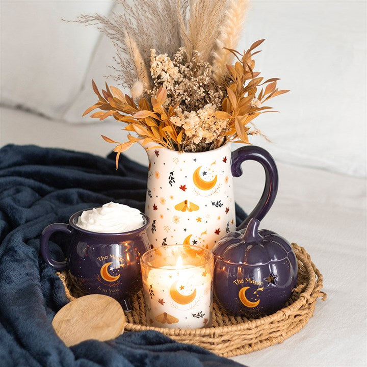 The Magic Is in You Pumpkin Oil Burner, a midnight-blue ceramic piece with golden stars for a cosy autumn ambience.