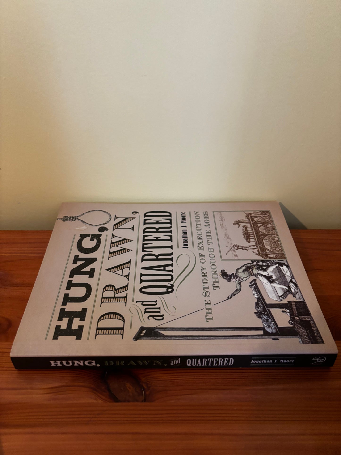 "Hung Drawn And Quartered The Story Of Execution Jonathan Moore book cover detailing historical executions."