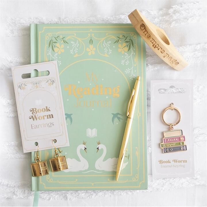 Book Worm wooden thumb page holder engraved 'Book Worm' fits over the thumb to keep pages open.