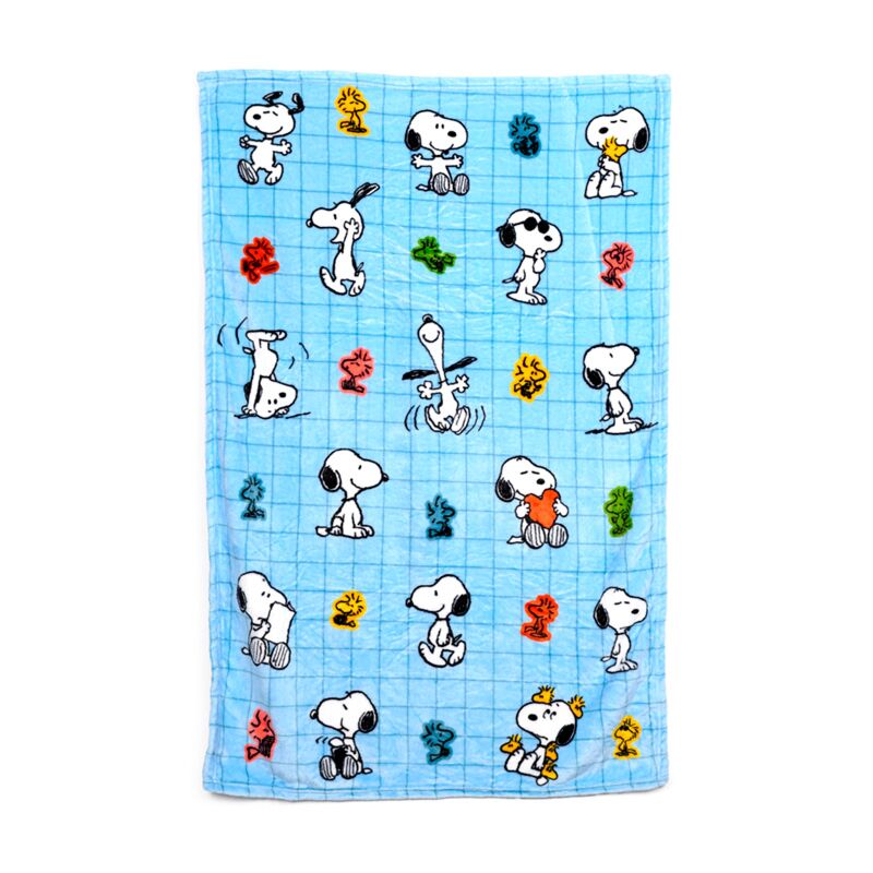 Blue Peanuts travel blanket featuring Snoopy and Woodstock patterns