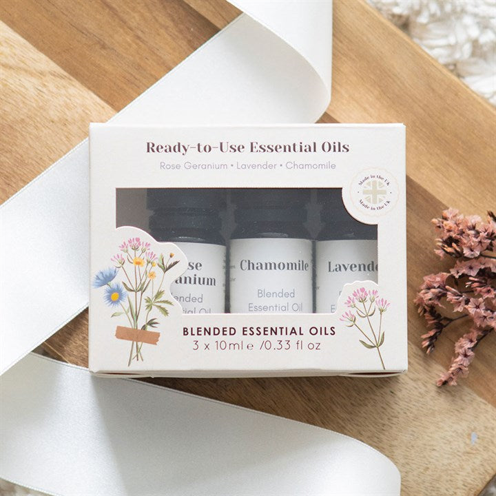 Set of 3 Floral Blended Essential Oils featuring Rose Geranium, Lavender, and Chamomile for relaxation and aromatherapy.