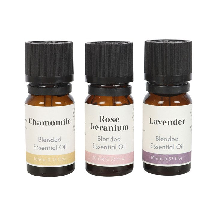 Set of 3 Floral Blended Essential Oils featuring Chamomile, Rose Geranium, and Lavender for relaxation at home.