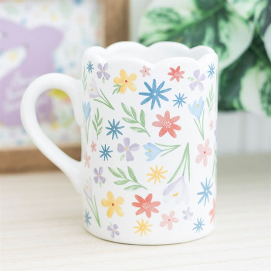 Brighten your mornings with the Spring Floral Print Scalloped Mug, featuring delicate pastel blooms and a charming rim.