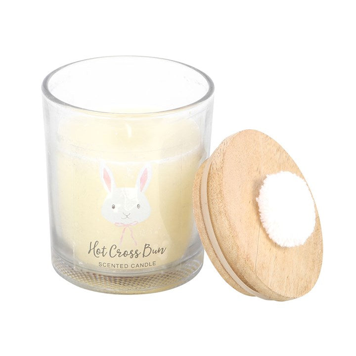 Sweetly scented Hot Cross Bun Candle with Easter bunny design and pom pom lid, perfect for gifting and home decor.