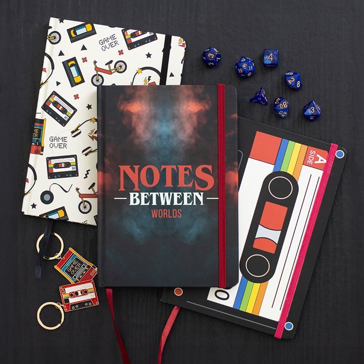Retro 80s Print A5 Notebook featuring nostalgic designs of cassette tapes and game controllers, perfect for notes and sketches.