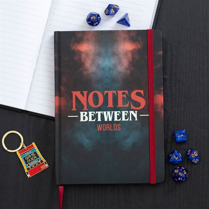 Notes Between Worlds A5 Notebook features a stunning red and blue swirling design, perfect for organised adventurers.