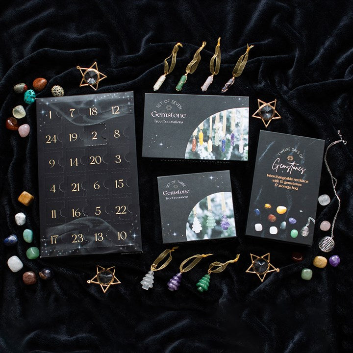 Mystical 24-Day Crystal Advent Calendar with 24 tumbled gemstones for Christmas spirit and wellbeing.