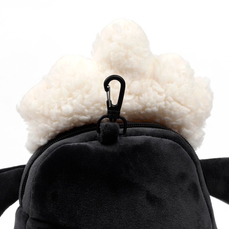 Relaxeazzz Shaun the Sheep travel set accessory: fluffy white pom-pom on a black bag with clip.